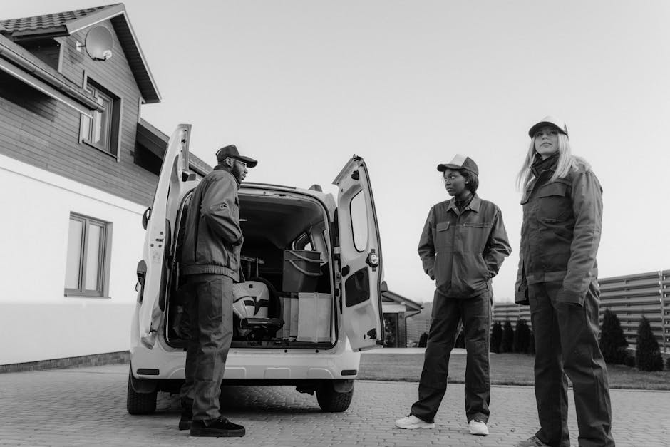 Roof repair service team working collaboratively on construction
